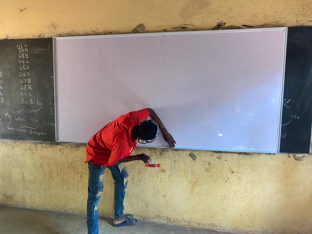 a whiteboard being installed by the carpenter